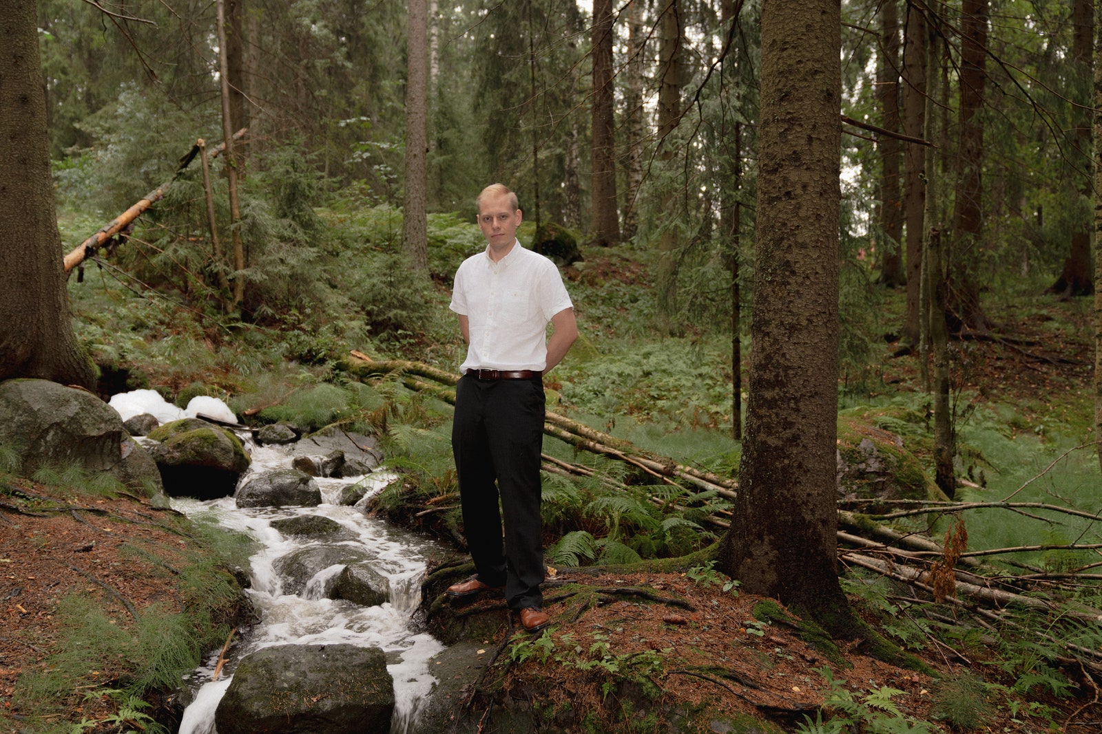 Tuure Parviainen, co-founder of Volare, stands in a forest.