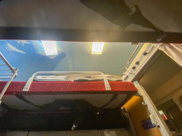 A view of the top bunks from the train's bottom bunk