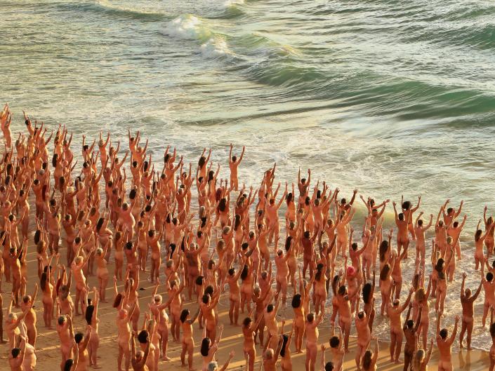 Group of naked people on Bondi Beach for photo shoot to raise awareness of cancer