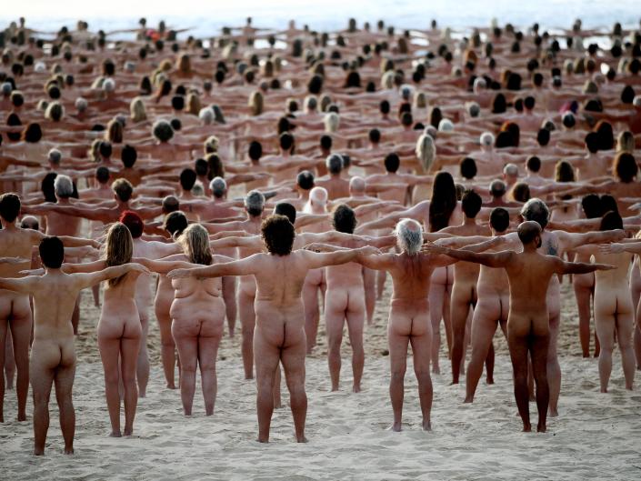 Group of naked people on Bondi Beach for photo shoot to raise awareness of cancer