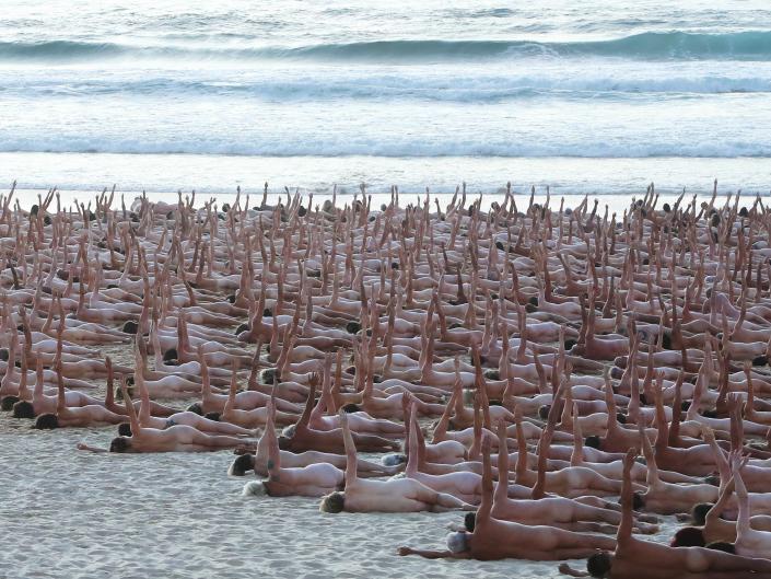 Group of naked people on Bondi Beach for photo shoot to raise awareness of cancer