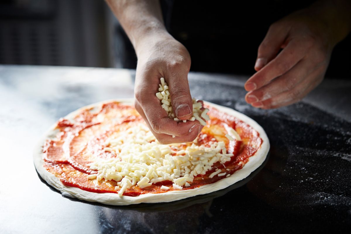 cook, put cheese on pizza