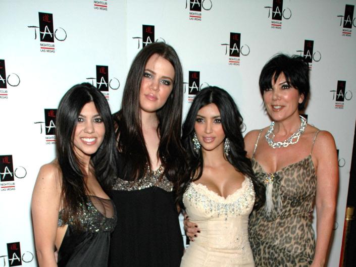 kourtney, khloé and kim kardashian with kris jenner on a red carpet at the first princess party at TAO Las Vegas in 2007. they all wear shorter dresses and kris wears a cheetah print dress