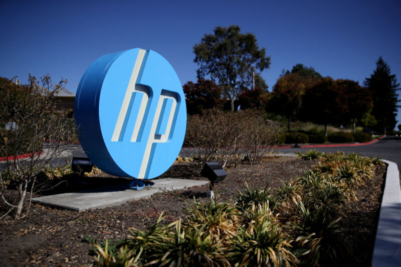 The Hewlett Packard (HP) logo is displayed in front of the office complex in Palo Alto, California on October 4, 2019.