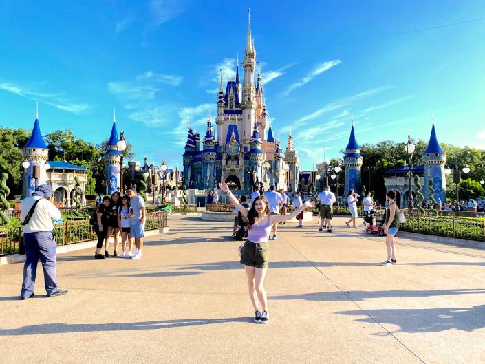 Insider reporter Amanda Krause poses in front of Cinderella's Castle at Disney World.