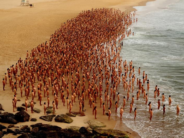 Group of naked people on Bondi Beach for photo shoot to raise awareness of cancer