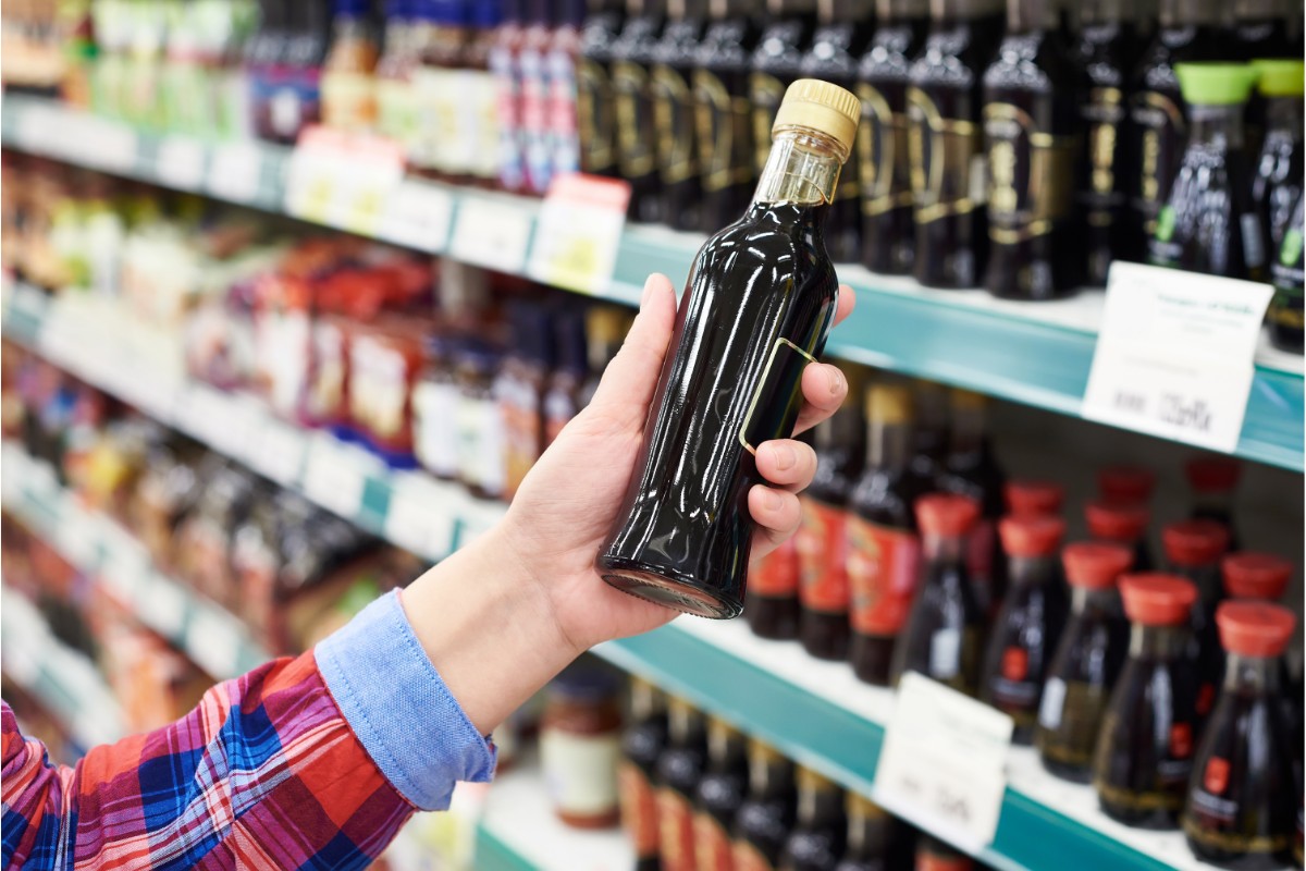 Shoppers with soy sauce in the store