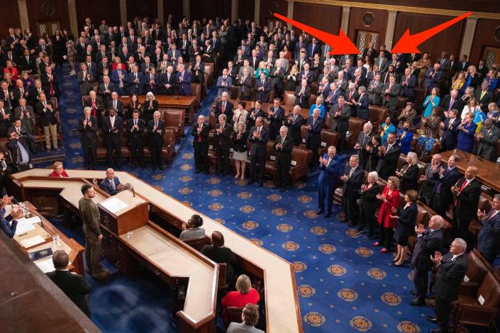 Representatives Lauren Boebert and Matt Gaetz stand as lawmakers give Ukrainian President Volodymyr Zelenskyy a standing ovation on Wednesday.