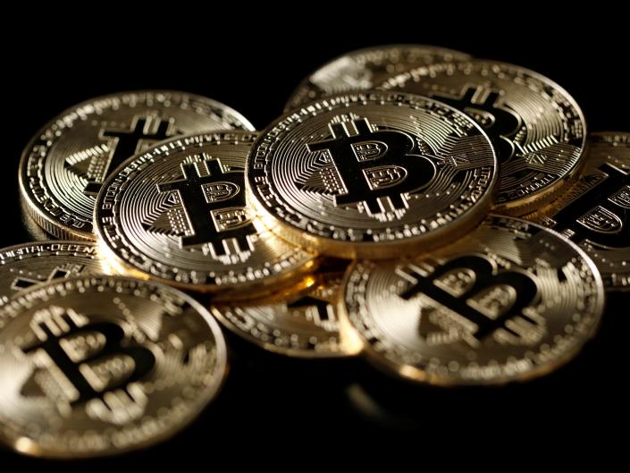 A collection of Bitcoin (virtual currency) tokens is shown in this image taken on December 8, 2017. REUTERS/Benoit Tessier/Illustration