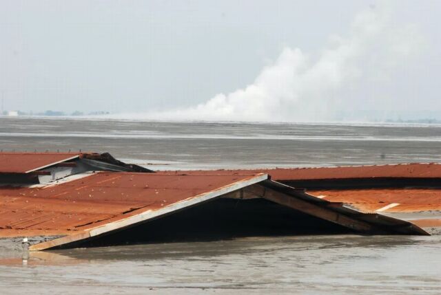 The mud attack forced tens of thousands of people to leave their homes. 