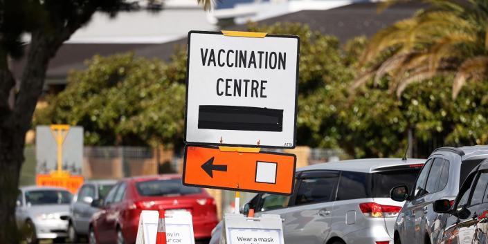 A vaccination center sign directs the public during a lockdown to contain the spread of a coronavirus disease (COVID-19) outbreak in Auckland, New Zealand, August 26, 2021