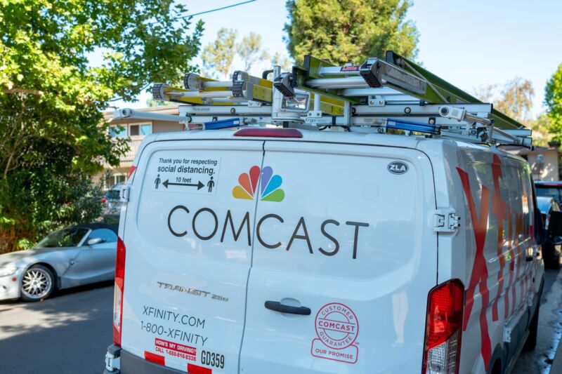 A Comcast service car seen from behind.