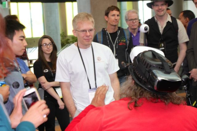 Oculus CTO John Carmack couldn't walk down the hall at the 2016 Oculus Connect conference without being mobbed by onlookers.  He was happy to have long impromptu question-and-answer sessions.