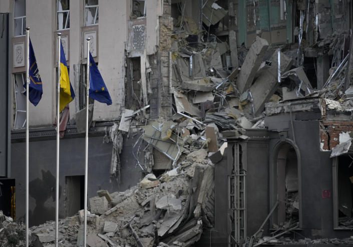 A damaged hotel at the site of Russian shelling in Kiev, Ukraine, Saturday, Dec. 31, 2022. (AP Photo/Efrem Lukatsky)