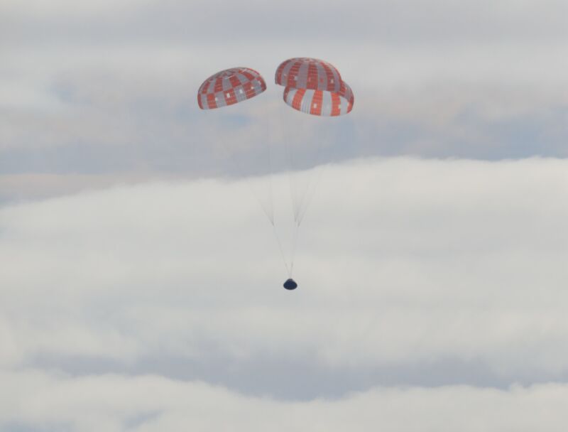 NASA's Orion spacecraft descends into the Pacific after a successful mission on Sunday.