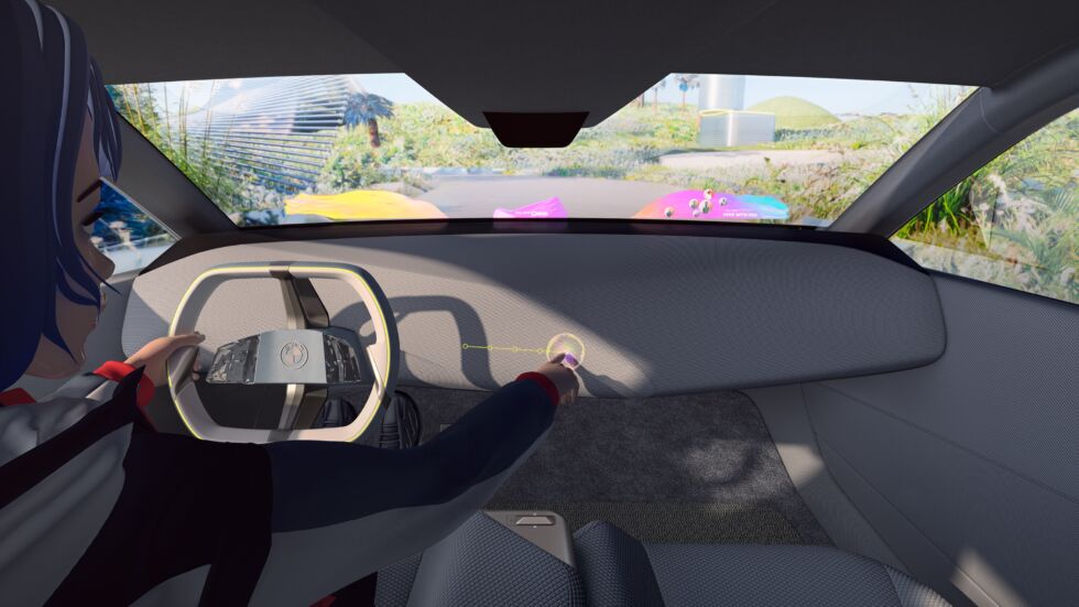 This view gives you an idea of ​​what the augmented reality windshield would look like.  You can also see the driver using the mixed reality slider "shy technology" it is hidden behind the trim on the dashboard and invisible when not in use.