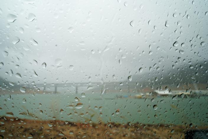 Raindrops seen through a windshield looking at the Pit River Bridge over Lake Shasta on Sunday, January 8, 2023.