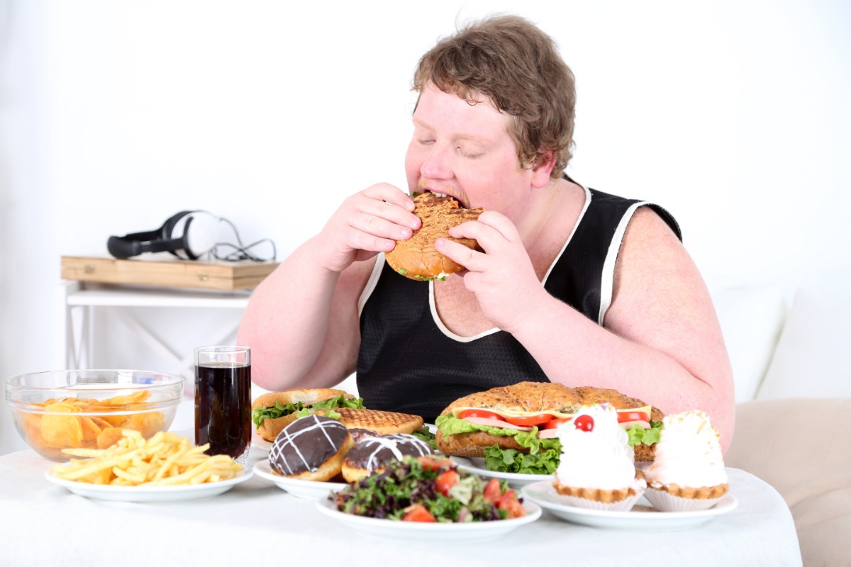 Man eating chicken sandwich