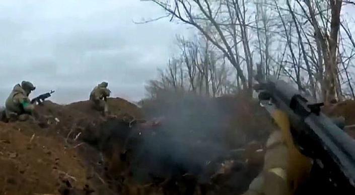 Ukrainian troops exchange small arms with Russian troops from a front-line trench near the eastern city of Bakhmut in late January 2023. / Credit: CBS News