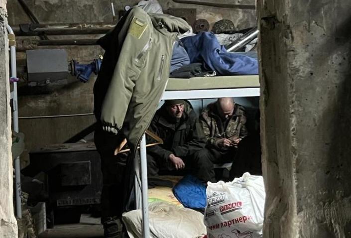 Ukrainian troops rest in a frontline bunker near the eastern city of Bakhmut amid the ongoing Russian invasion of the country in late January 2023. /Credit: CBS News