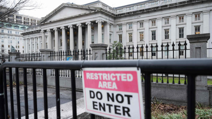 The building of the Ministry of Finance.  A sign in the foreground, attached to a fence, reads: Forbidden area.  Do not enter.