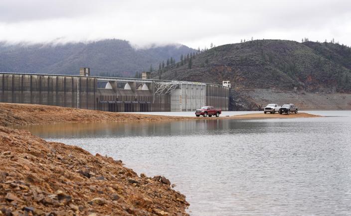 A red pickup drives back to the Centimudi Boat Launch on Lake Shasta near Shasta Dam.