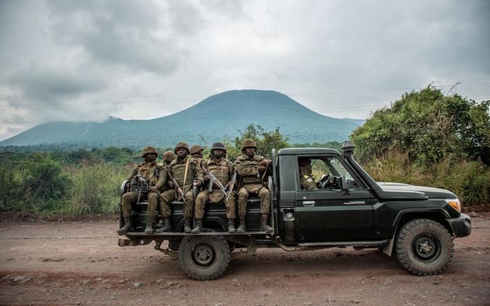 A Congolese army pickup with troops moves to the frontline in May 2022 - ARLETTE BASHIZI / AFP