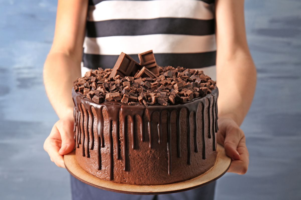 Woman Holding Chocolate Cake