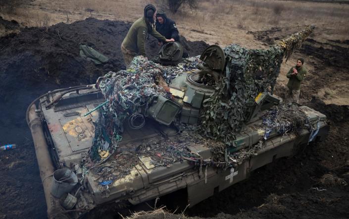 Members of a Ukrainian army tank crew check the vehicle at a military base in Zaporizhzhia - Kateryna Klochko/PA