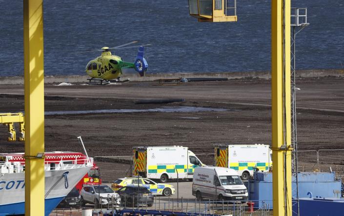 An air ambulance is on the scene after a ship overturned in the Imperial Dock area in Leith