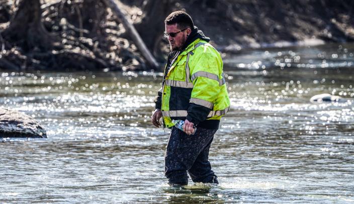 Volunteer Cody Bales of Eaton searches the river near the intersection of Eaton-Wheeling Pike and Walnut St. for missing child Scottie Dean Morris, in Eaton Ind.  on Monday, March 20, 2023. Morris, 14, left his family's Eaton home around 8:30 p.m. Thursday, March 16, 2023, and has not been seen since.