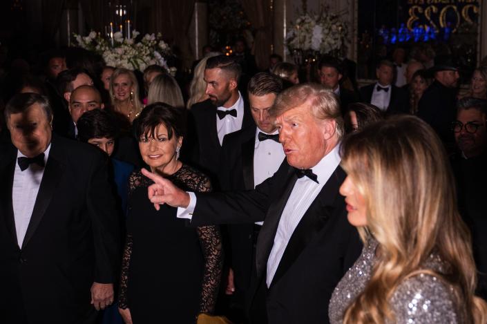 Former President Donald Trump and his wife, Melania Trump, are seen in the Mar-A-Lago Ballroom on New Year's Eve 2022.