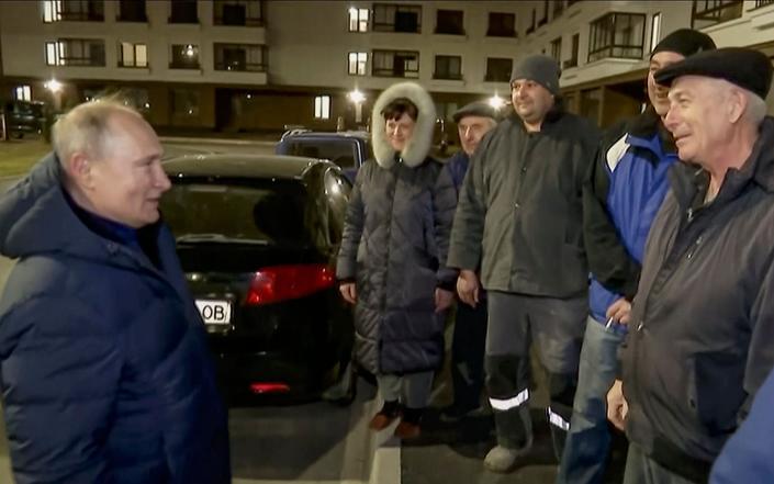 Television footage of the Russian president supposedly meeting grateful Ukrainians shows a woman's voice yelling, 