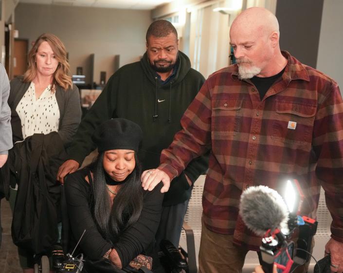 Stephen Foster, right, the father of Garrett Foster, consoles Garrett's wife, Whitney Mitchell, on Friday after Daniel Perry was convicted of murder in Garrett Foster's 2020 shooting death.