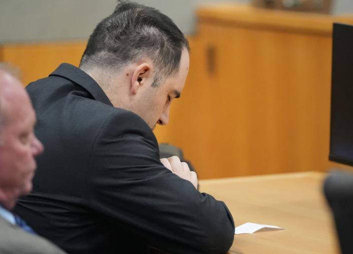 Daniel Perry closes his eyes and bows his head Friday just before he was convicted of murder in the death of protester Garrett Foster on July 25, 2020.