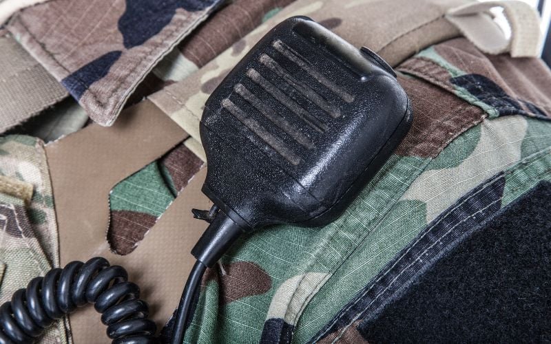 a closeup of a radio on a uniformed army soldier