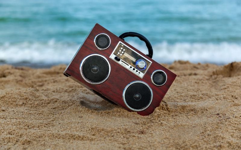 Radio angled on the sand at the beach 