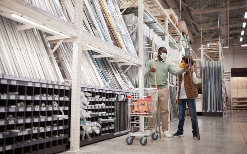 Two people with masks are shopping in a hardware store