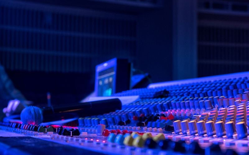 A radio center and other equipment bathed in bright blue light 