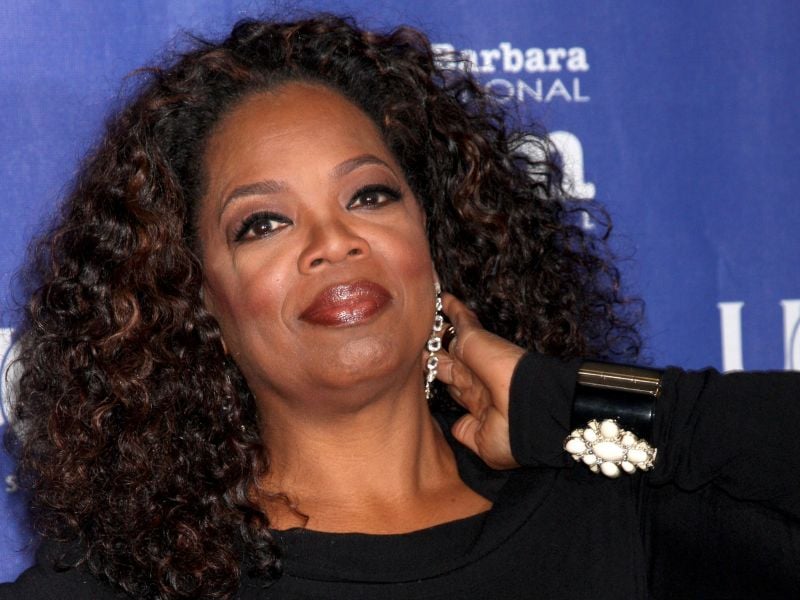 a picture of Oprah in a black dress