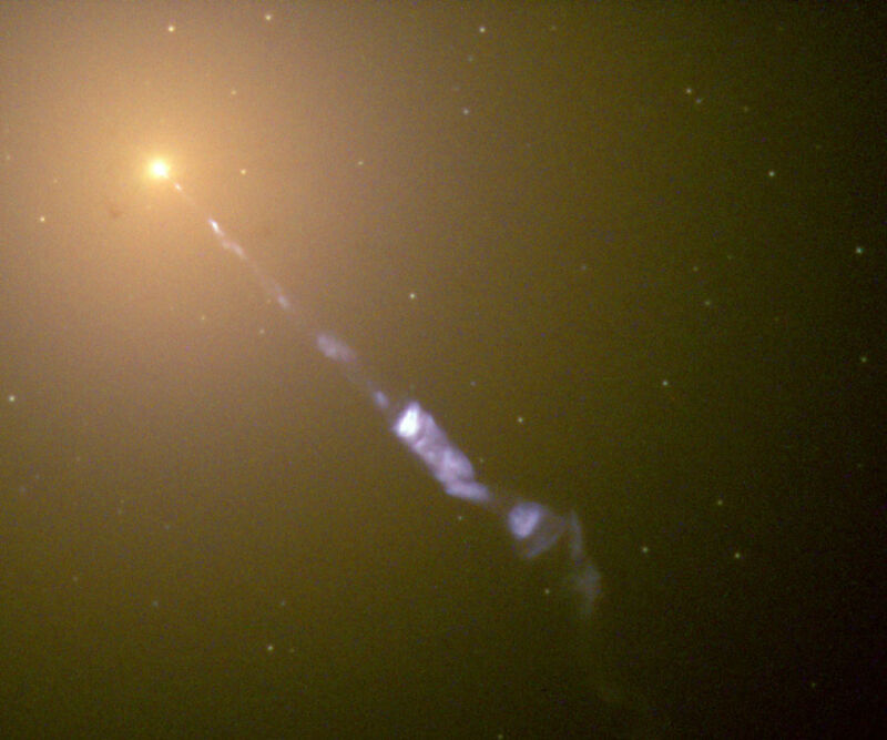 Image of a bright object at upper left, with a stream of material projected to the lower right.