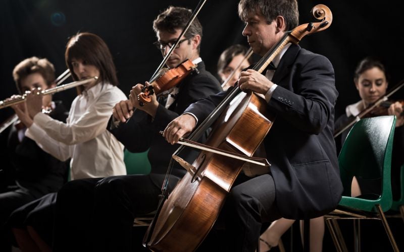 Classical music orchestra performing on stage in the United States