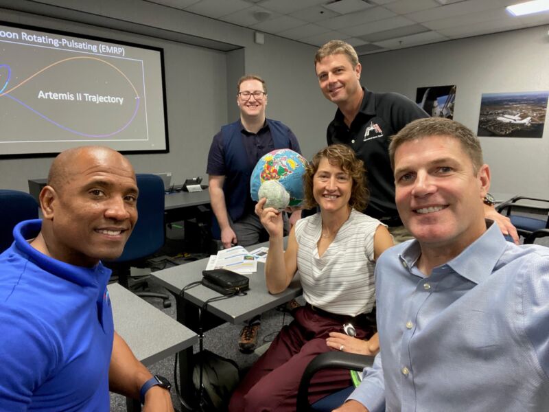 Astronauts Victor Glover, Christina Koch, Reid Wiseman and Jeremy Hansen are joined by an instructor (background) on the first day of training for the Artemis II crew.