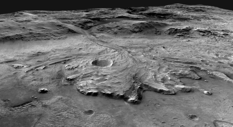 Grayscale image of a large array of material scattered across a crater floor.