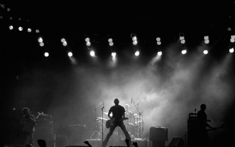 Canadian radio rock band on a smoky stage in black and white