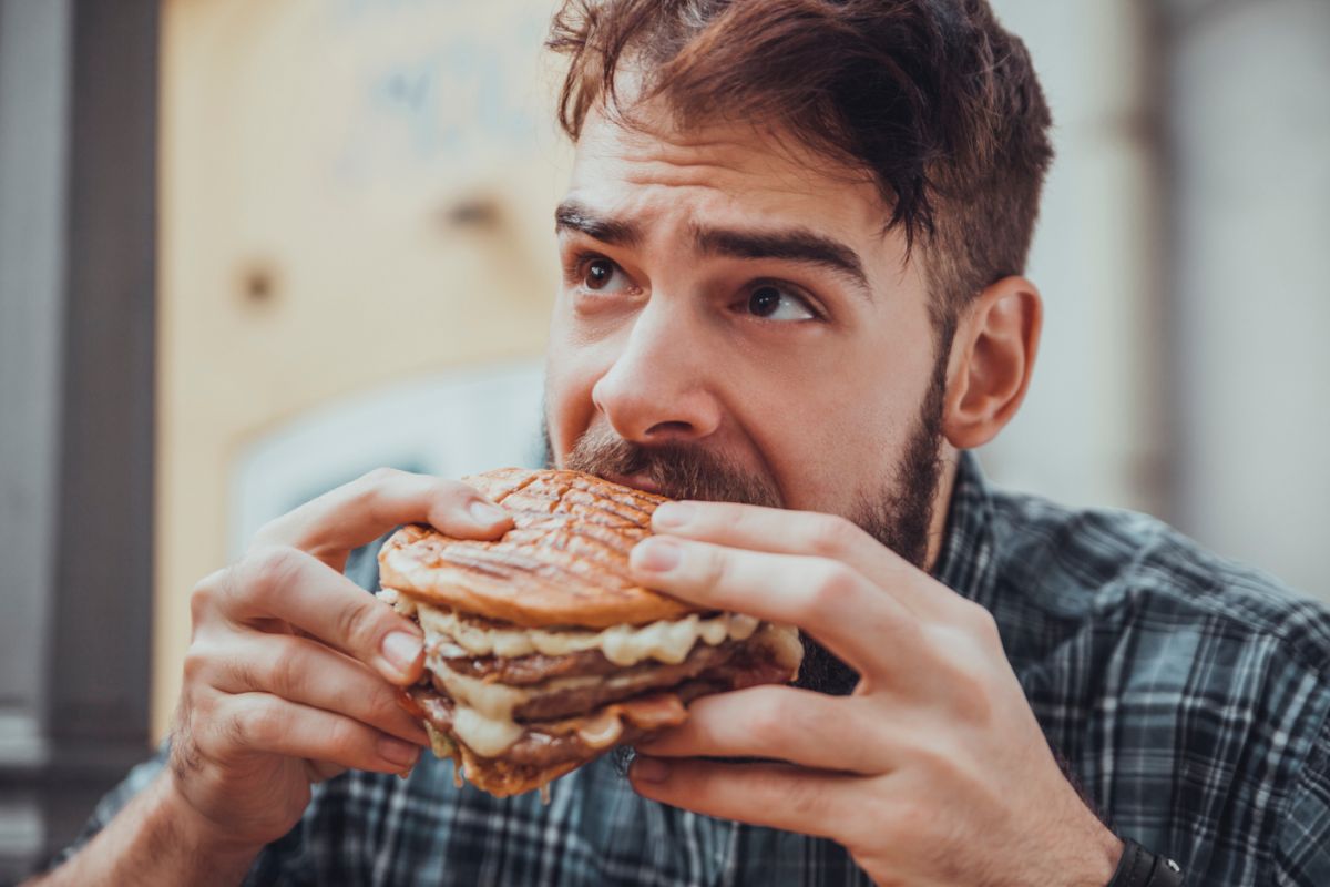 Male Eating Burger