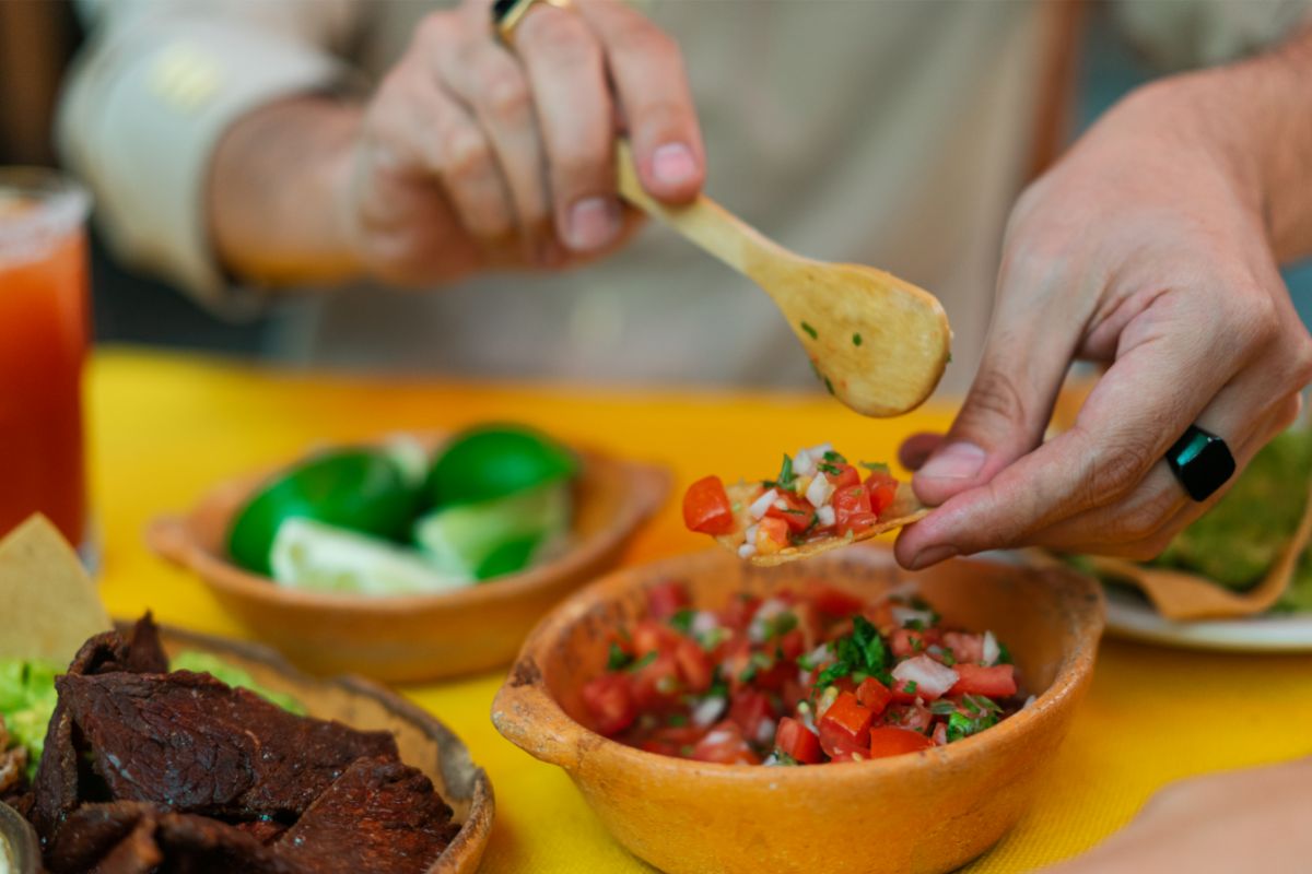 person-holding-brown-wooden-spoon